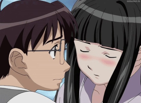 A Man And A Woman Are Looking At Each Other With Animekol.to Written On The Bottom Right GIF