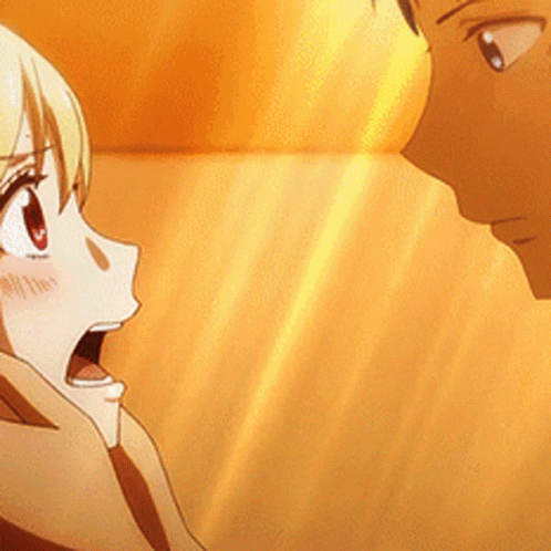 A Man And A Woman Are Looking At Each Other With The Woman Looking Surprised GIF