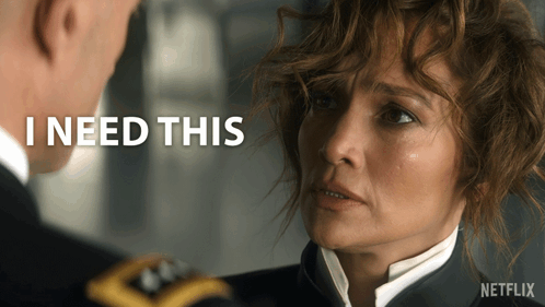 Man And Woman Looking At Each Other With I Need This Behind Them GIF