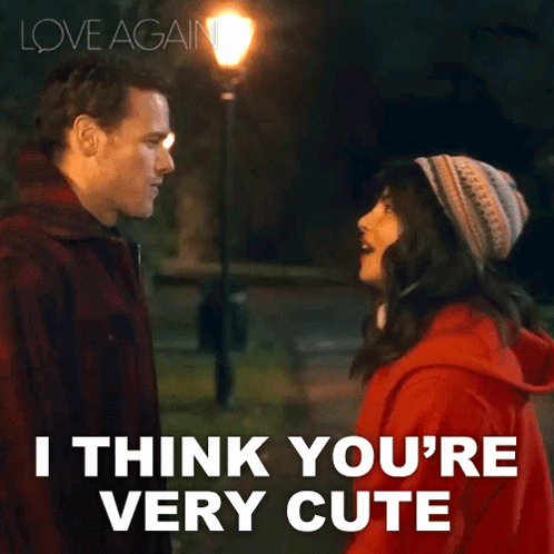 A Man And A Woman Are Looking At Each Other With The Words " I Think You 'Re Very Cute " Below Them GIF