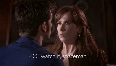 A Man And A Woman Are Looking At Each Other With The Words Oi Watch It Spaceman GIF