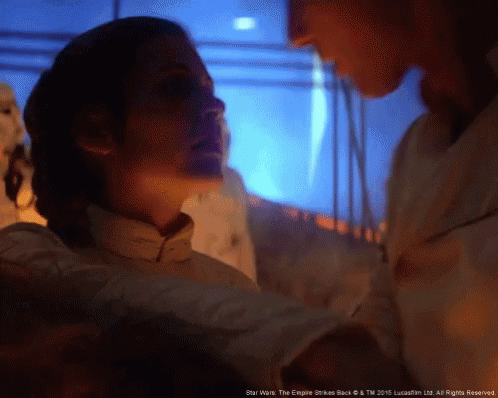 A Man And A Woman Are Looking At Each Other With The Words Star Wars The Empire Strikes Back At The Bottom GIF