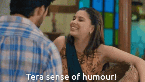 A Man And A Woman Are Looking At Each Other With The Words Tera Sense Of Humour Below Them GIF