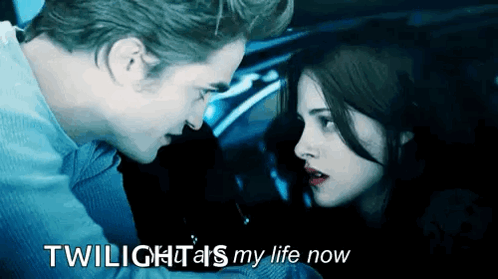 A Man And A Woman Are Looking At Each Other With The Words Twilight 'S My Life Now GIF