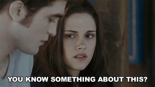 A Man And A Woman Are Looking At Each Other With The Words " You Know Something About This " Below Them GIF