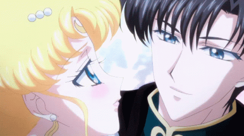 A Man And A Woman Are Looking At Each Other With Their Eyes Closed GIF