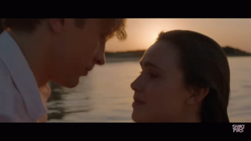 A Man And A Woman Are Looking Into Each Other 'S Eyes With The Words Shiki Pix On The Bottom Of The Screen GIF