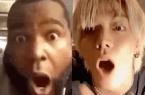 A Man And A Woman Are Making Funny Faces With Their Mouths Open . GIF