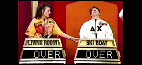 A Man And A Woman Are Playing A Game Called Living Room Over Ski Boat GIF