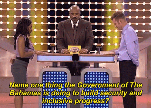A Man And A Woman Are Playing A Game Show Called Name One Thing GIF