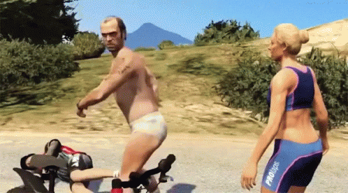 A Man And A Woman Are Playing A Video Game And The Man Is Wearing A Diaper And The Woman Is Wearing A Bikini GIF
