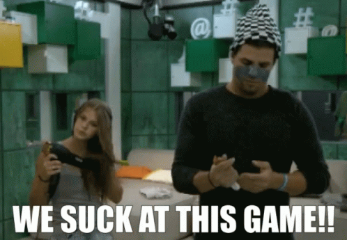 A Man And A Woman Are Playing A Video Game With The Words We Suck At This Game GIF