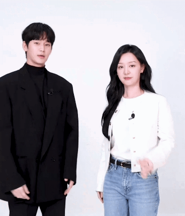 A Man And A Woman Are Posing For A Picture Together GIF