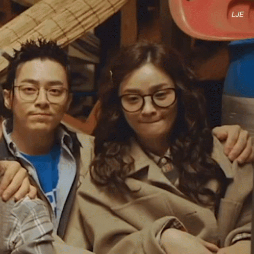 A Man And A Woman Are Posing For A Picture With The Letters Lje On The Bottom GIF