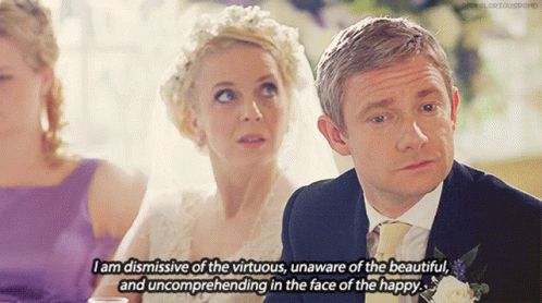 A Man And A Woman Are Sitting At A Table And The Man Is Saying " I Am Dismissive Of The Virtuous GIF