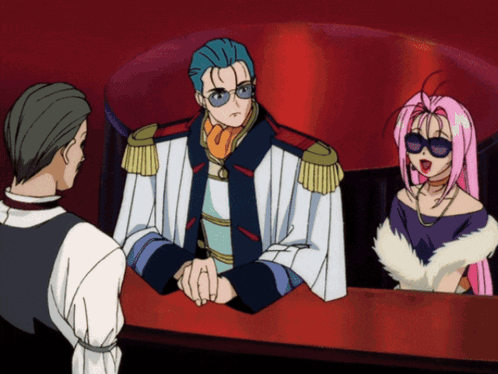 A Man And A Woman Are Sitting At A Table In A Cartoon Scene GIF