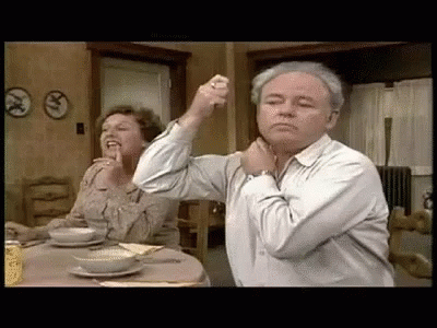 Man And Woman Sitting At Table GIF