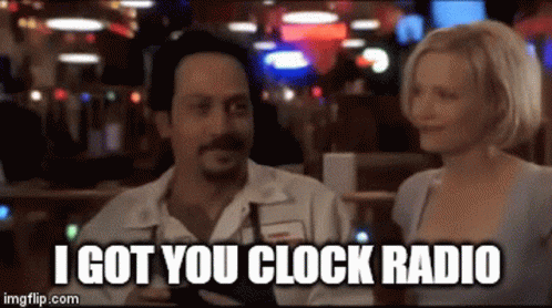 A Man And A Woman Are Sitting At A Table With A Caption That Says I Got You Clock Radio GIF