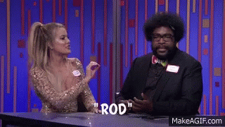 A Man And A Woman Are Sitting At A Table With The Word Rod Written On The Table GIF