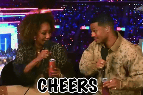 Man And Woman Sitting At Table Cheers GIF