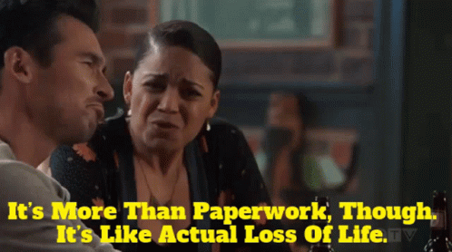 A Man And A Woman Are Sitting At A Table With The Words It 'S More Than Paperwork GIF