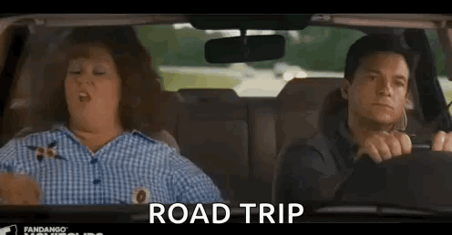 A Man And A Woman Are Sitting In A Car And The Woman Is Yawning . GIF