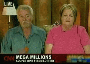 A Man And A Woman Are Sitting In Front Of A Cnn Mega Millions Couple Wins $ 164 M Lottery Banner GIF