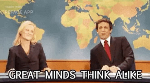A Man And A Woman Are Sitting In Front Of A Map Of The World On A Television Show . GIF