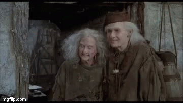 A Man And A Woman Are Sitting Next To Each Other And Saying `` Bye Bye ! '' GIF