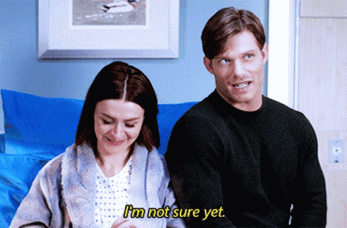 Man And Woman Sitting Next To Each Other Woman Says I'm Not Sure Yet GIF