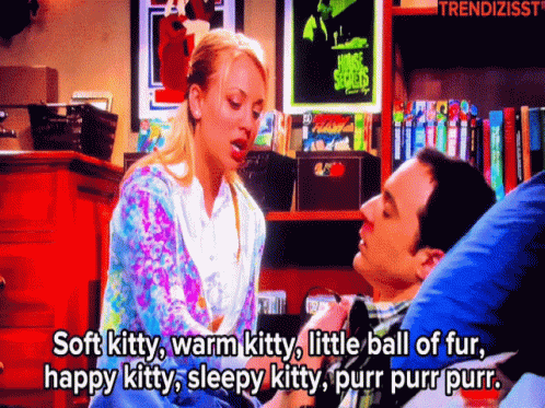 A Man And A Woman Are Sitting Next To Each Other And The Woman Is Saying Soft Kitty GIF