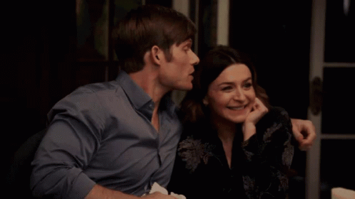 Man And Woman Sitting Together Woman Smiling GIF