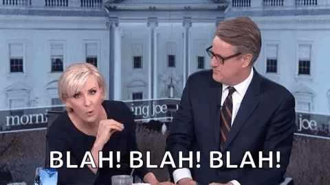A Man And A Woman Are Sitting Next To Each Other In Front Of A White House And Talking . GIF
