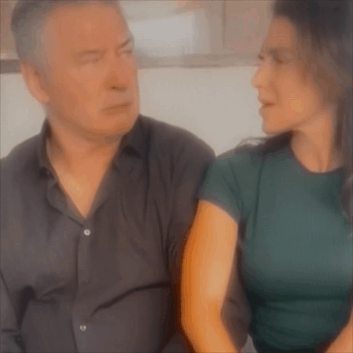 Man And Woman Sitting On Couch GIF