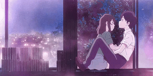 A Man And A Woman Are Sitting Next To Each Other On A Window Sill And Kissing . GIF