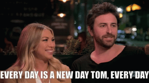 A Man And A Woman Are Sitting Next To Each Other With The Caption Every Day Is A New Day Tom Every Day GIF