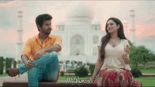 A Man And A Woman Are Sitting On A Bench In Front Of A Mosque And The Words Mr Romantic Are Visible GIF