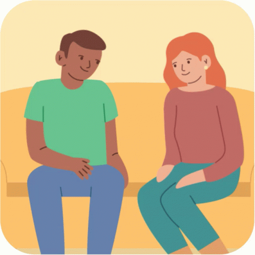 A Man And A Woman Are Sitting On A Couch And Smiling GIF
