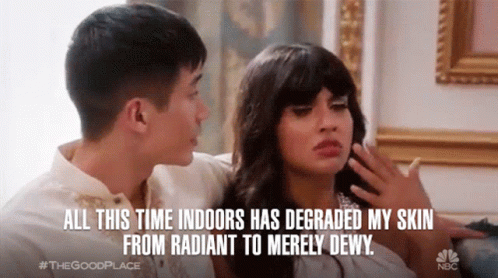 A Man And A Woman Are Sitting On A Couch And The Man Says All This Time Indoors Has Degraded My Skin From Radiant GIF