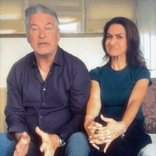 Man And Woman Sitting On Couch Woman Making Face GIF