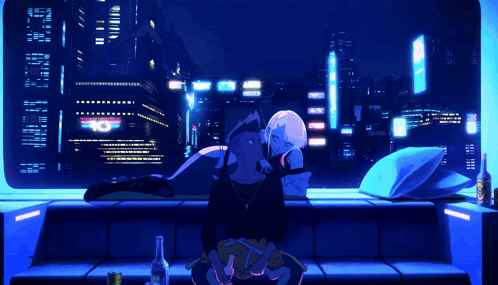 A Man And A Woman Are Sitting On A Couch In Front Of A Window With A Sign That Says 10 On It GIF