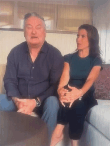 Man And Woman Sitting On Couch Talking GIF