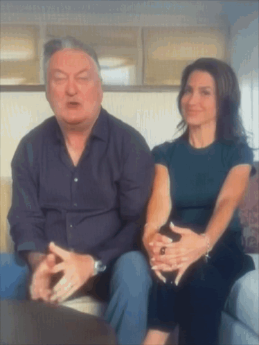 Man And Woman Sitting On Couch Talking GIF