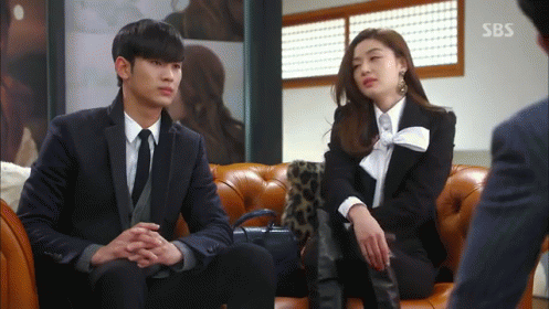 A Man And A Woman Are Sitting On A Couch With Sbs Written On The Bottom GIF