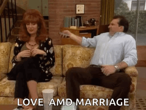 Man And Woman Sitting On Couch Love And Marriage GIF
