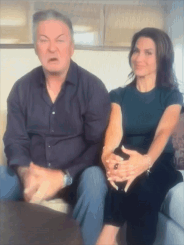 Man And Woman Sitting On Couch GIF