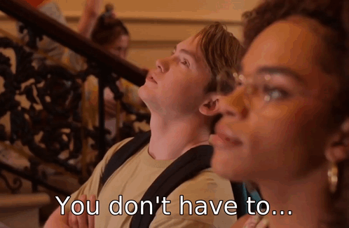A Man And A Woman Are Sitting On A Set Of Stairs And The Man Says " You Don 'T Have To " GIF