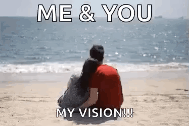 A Man And A Woman Are Sitting On The Beach And Looking At The Ocean . GIF