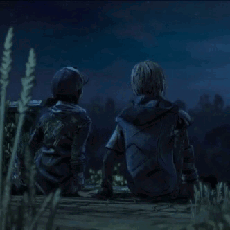A Man And A Woman Are Sitting On The Ground Looking At The Night Sky . GIF