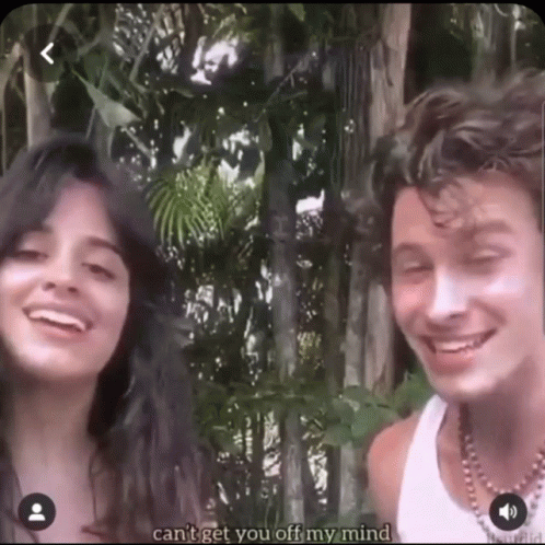 A Man And A Woman Are Smiling In Front Of Trees And The Man Says " Can 'T Get You Off My Mind " GIF